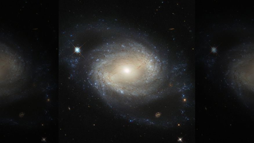 Hubble Space Telescope Captures Stunning Image Of Barred Spiral Galaxy ...