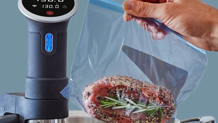 Anova sous vide precision cooker being used to cook a steak