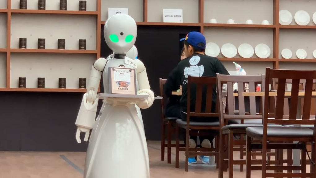 The robot shop worker controlled by a faraway human