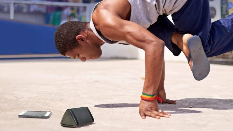 A man listening to music on the OontZ Angle 3 Bluetooth Portable Speaker