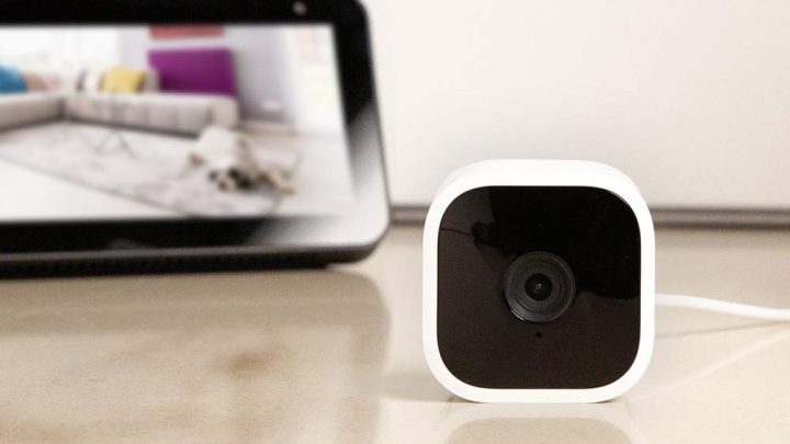 Amazon's Blink Mini home security camera next to an Echo Show 5