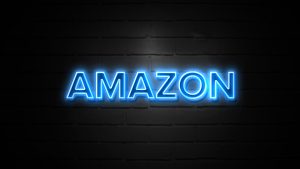 Amazon logo in blue on a black background with brick texture