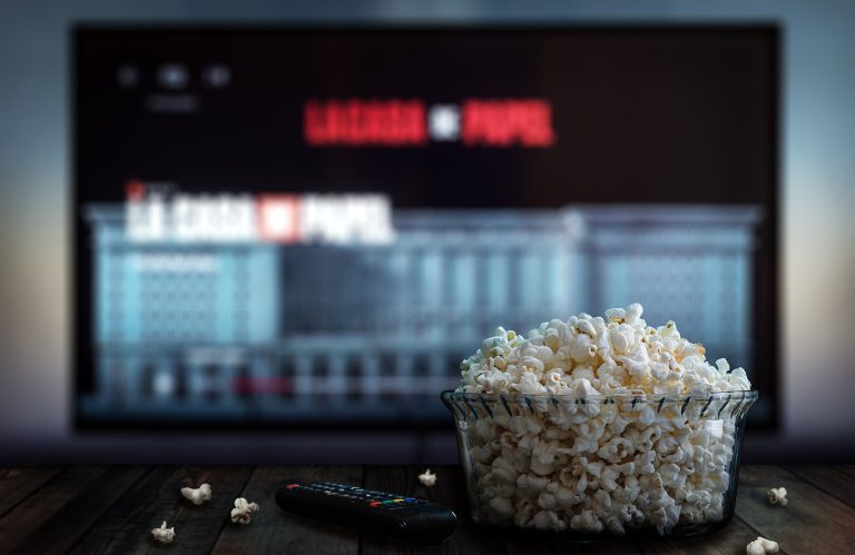 Netflix on a TV with a bowl of popcorn