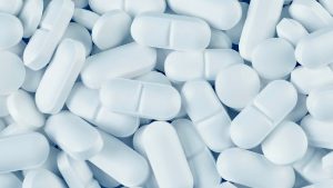 A pile of white medicine pills