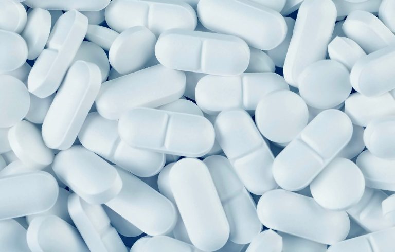 A pile of white medicine pills