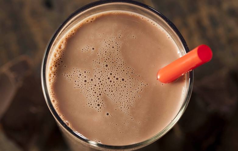 a glass of chocolate milk. image source: brent hofacker/adobe