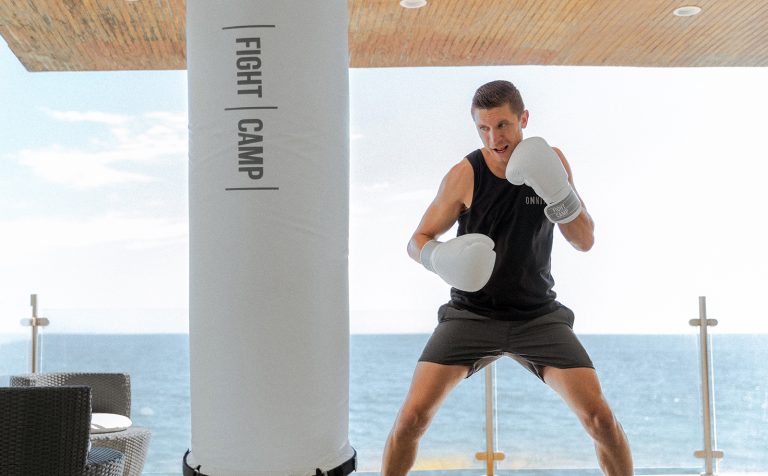 A boxer squaring up with a punching bag