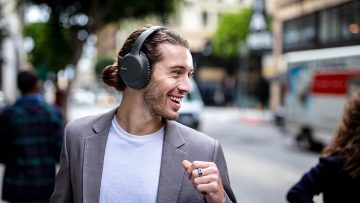 A man wearing the Sony-WHCH710N/B over ear headphones
