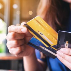 Woman holding credit cards Woman's hand holding credit cards