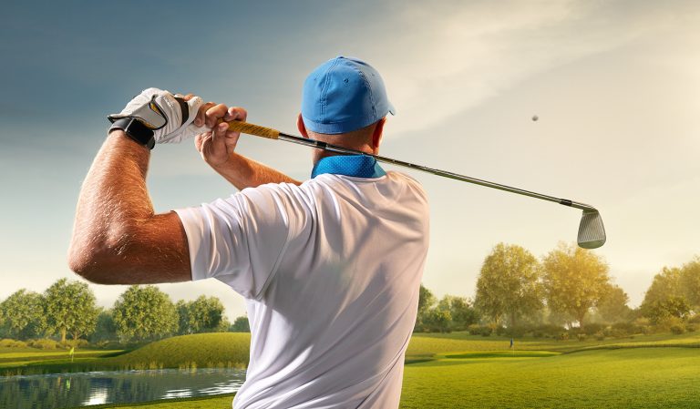 A golfer hits a difficult shot onto the green from 180 yards out