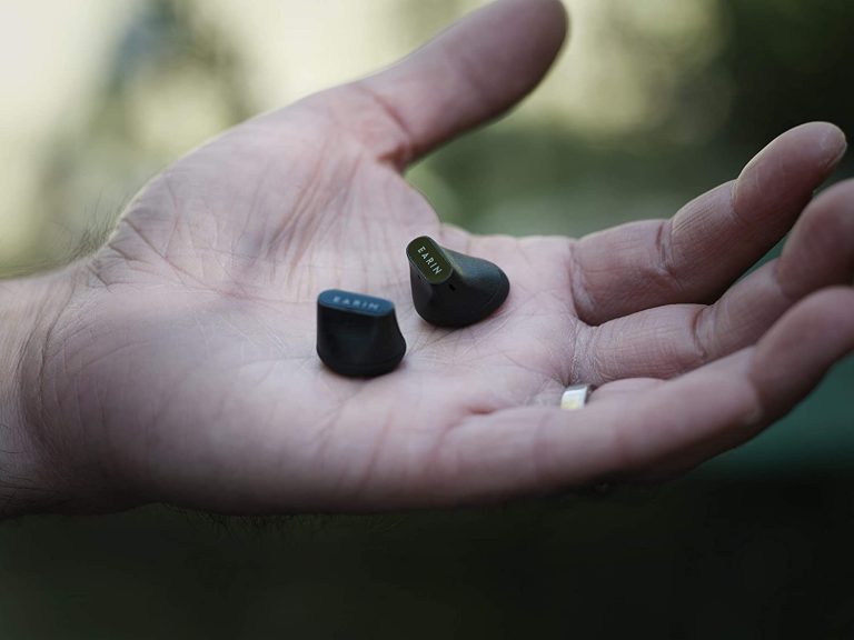 A hand holding the Earin A-3 True Wireless Earbuds