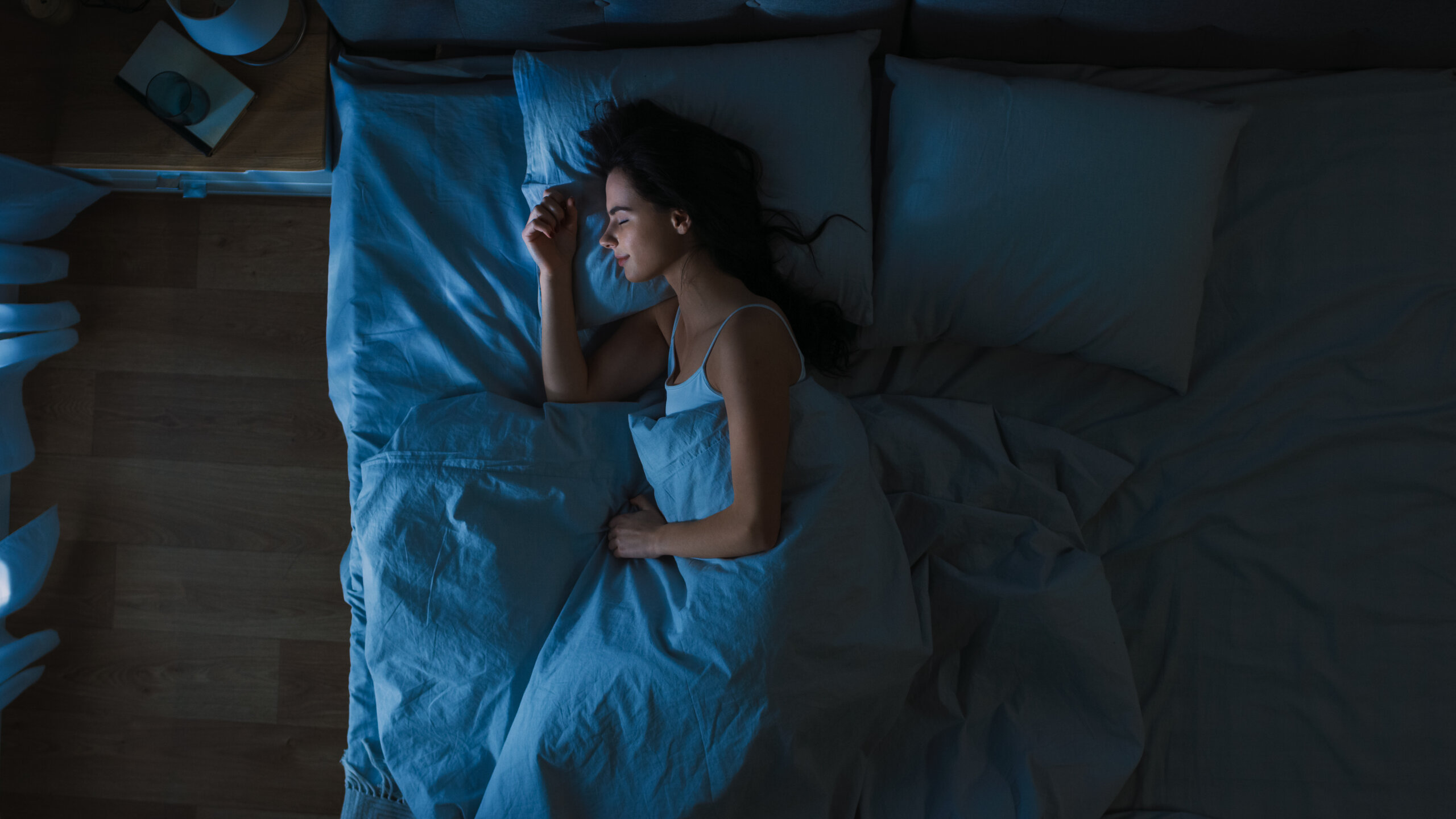 woman sleeping with light in the room