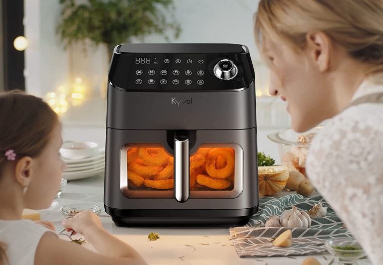 A mother and child cooking food in an air fryer