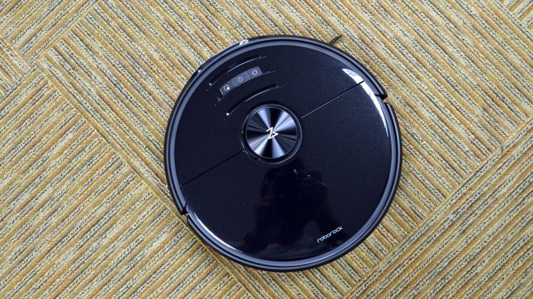 The Roborock S6 MaxV robot vacuum cleaning a hardwood floor