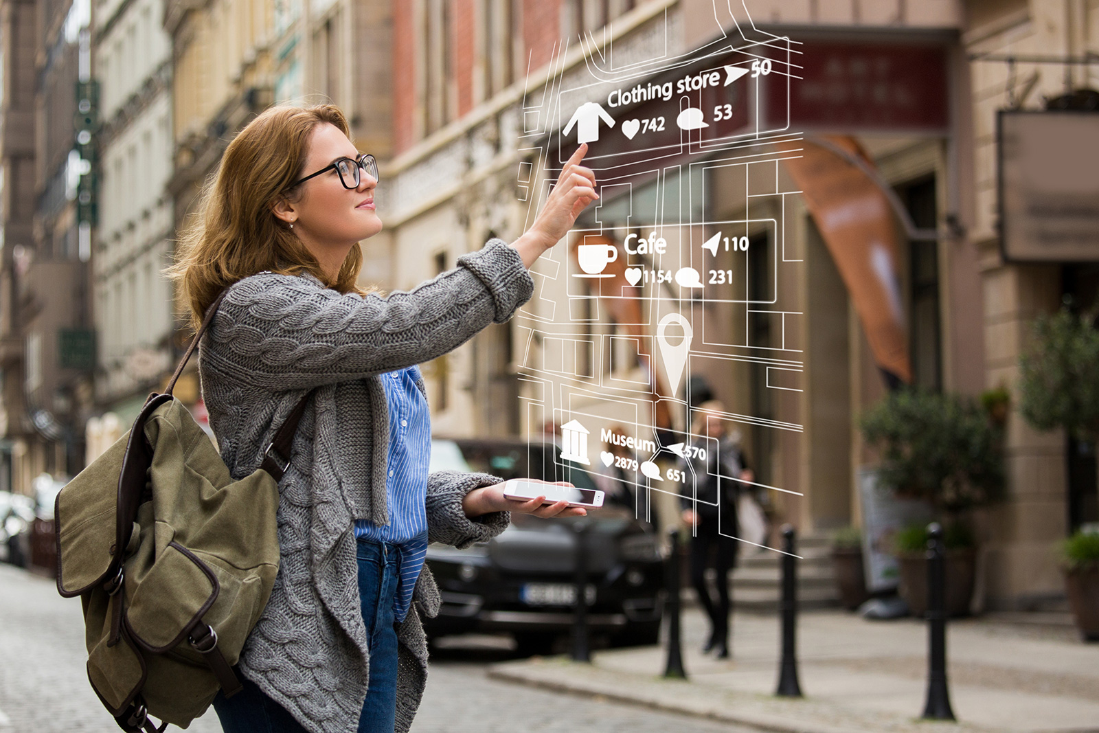 A woman uses the augmented reality features on her AR glasses