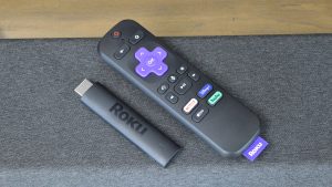The Roku Streaming Stick 4K next to its remote