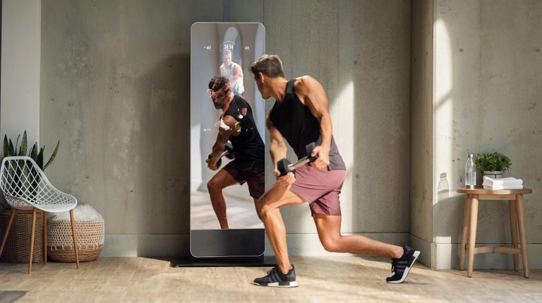 A man working out with the NordicTrack VAULT mirror gym