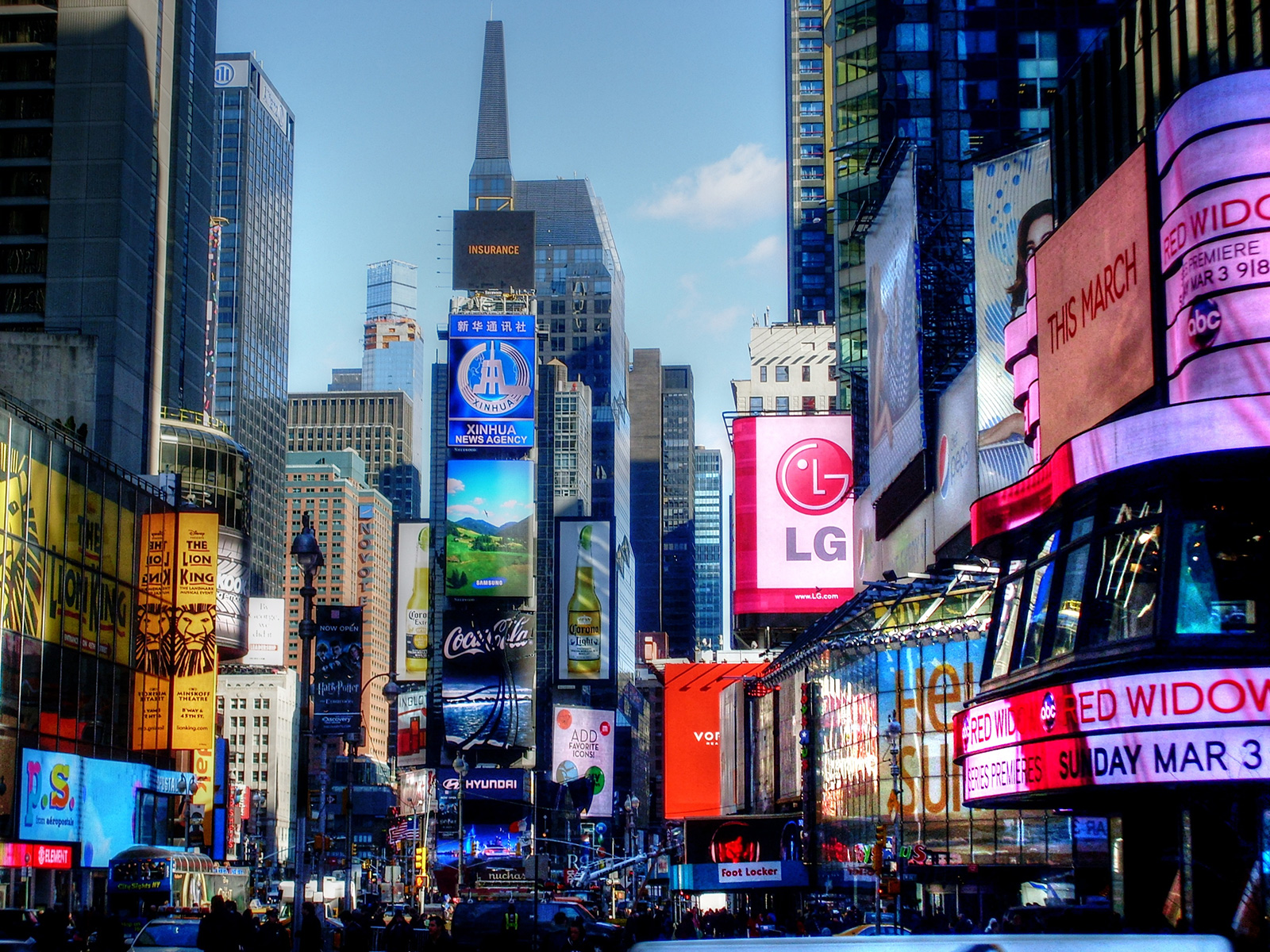 Illuminated Advertisements On Modern Buildings In City