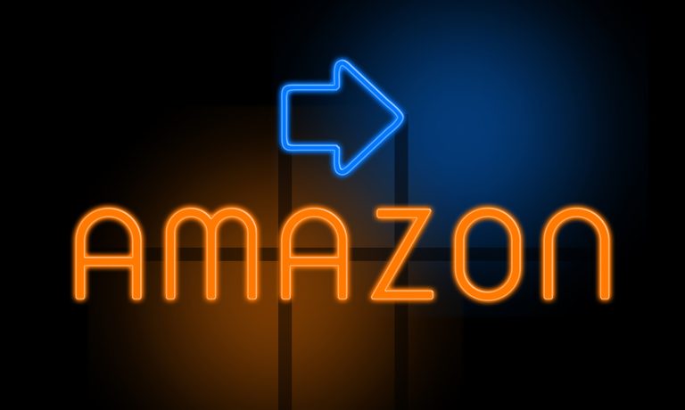 Amazon in orange glowing text with an arrow on dark background