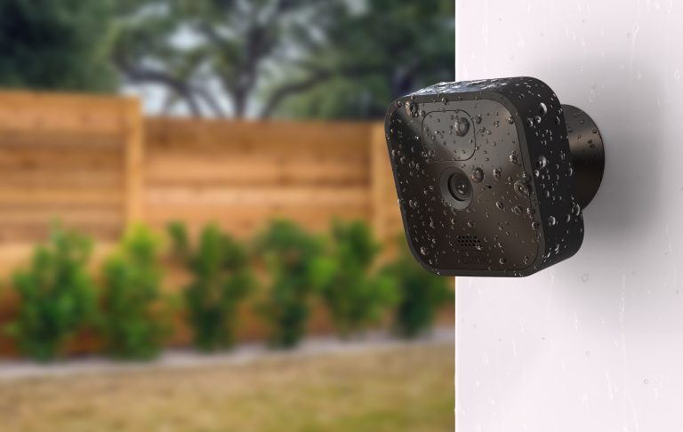 Blink Outdoor home security camera on an outside wall of someone's home