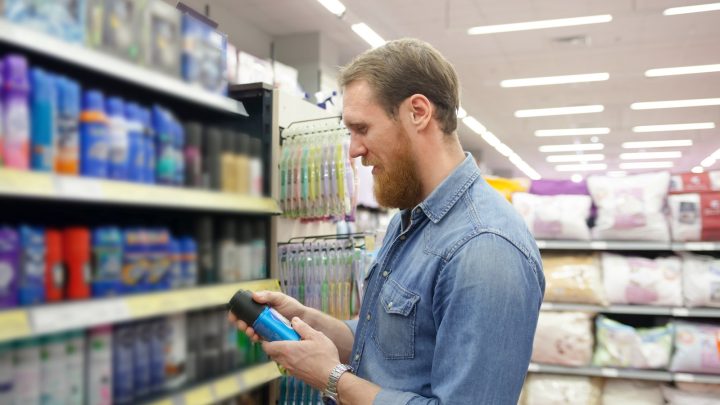 A person looking at deodorants in a store