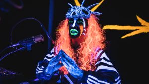hellbound person in brightly colored skull mask