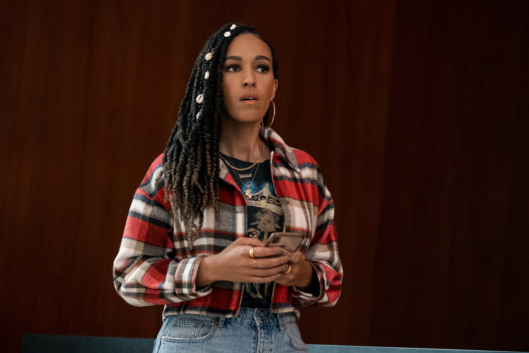 woman wearing plaid and blue jeans