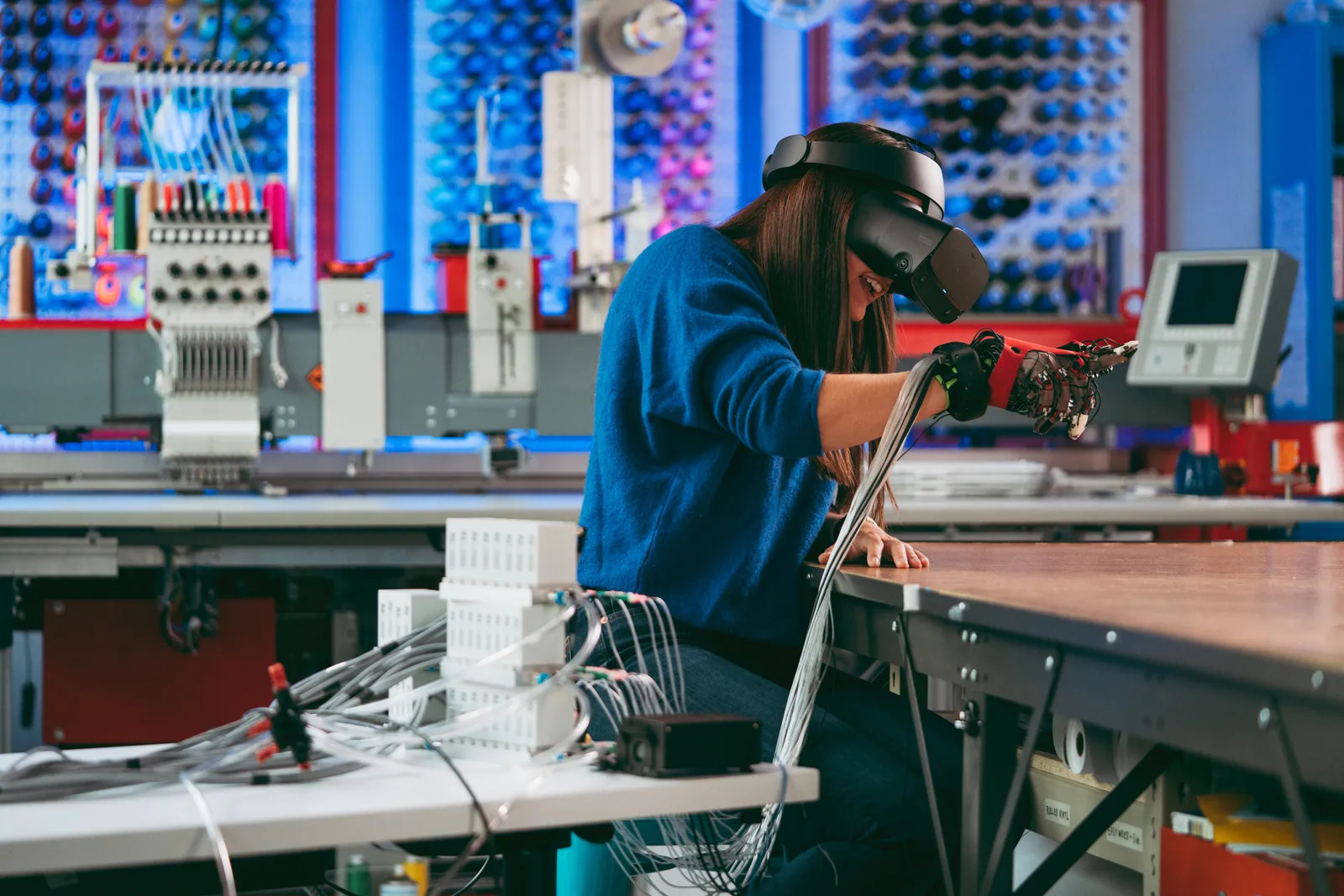 Woman using Facebook haptic glove