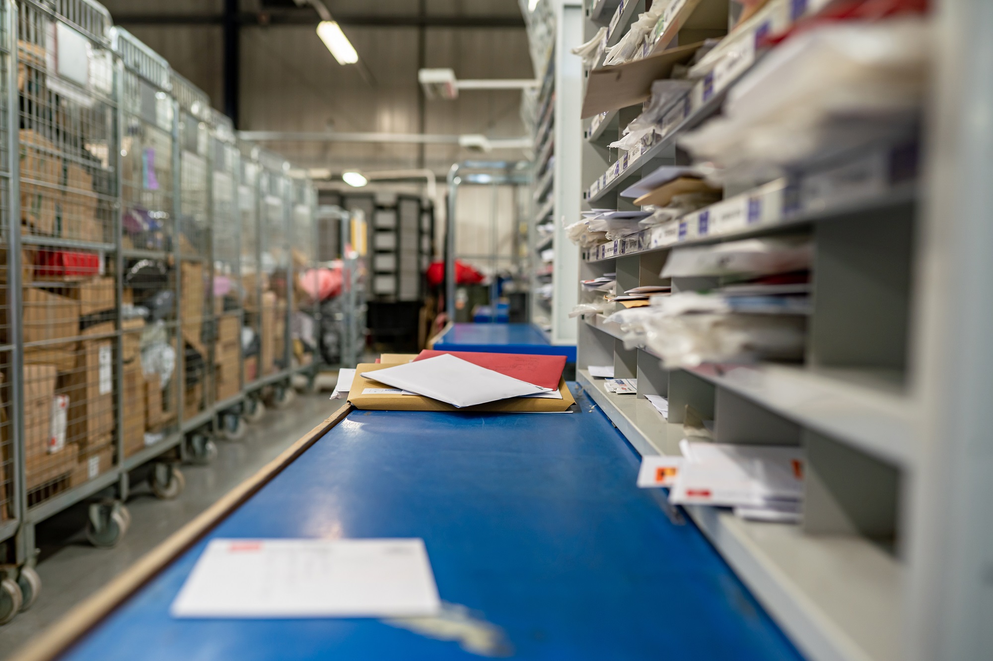 Letters on a table in a mail centre sorting office