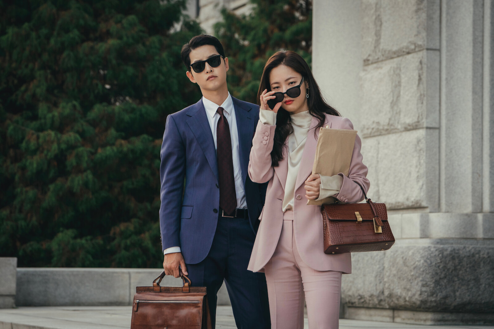 woman in pink suit with man in blue suit