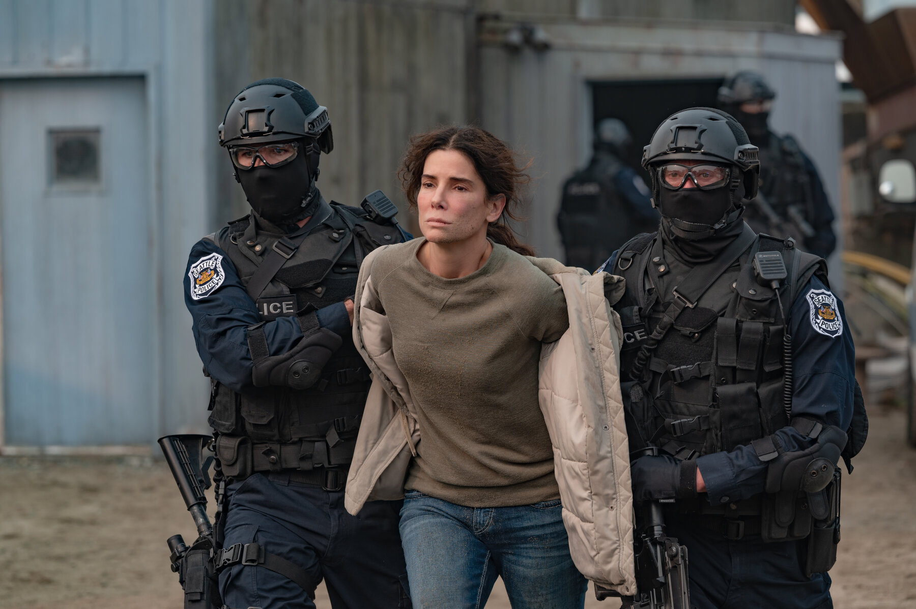 sandra bullock between two policemen