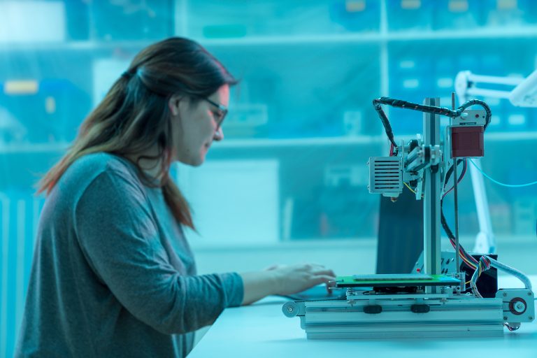 young woman design printing of the metamaterials on a 3D printer