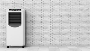 Portable air conditioner next to a wall