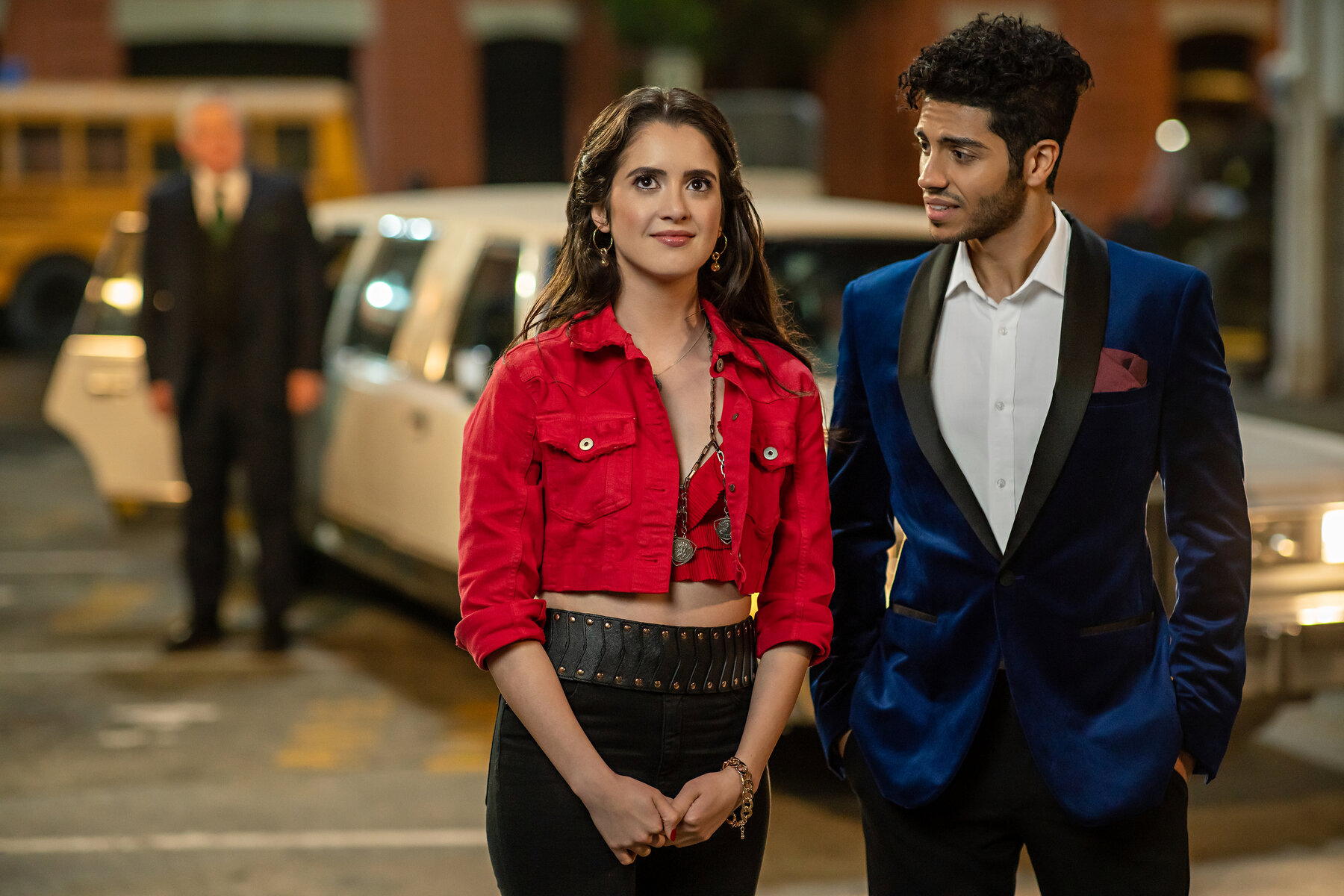 a man and a woman in red stand close together