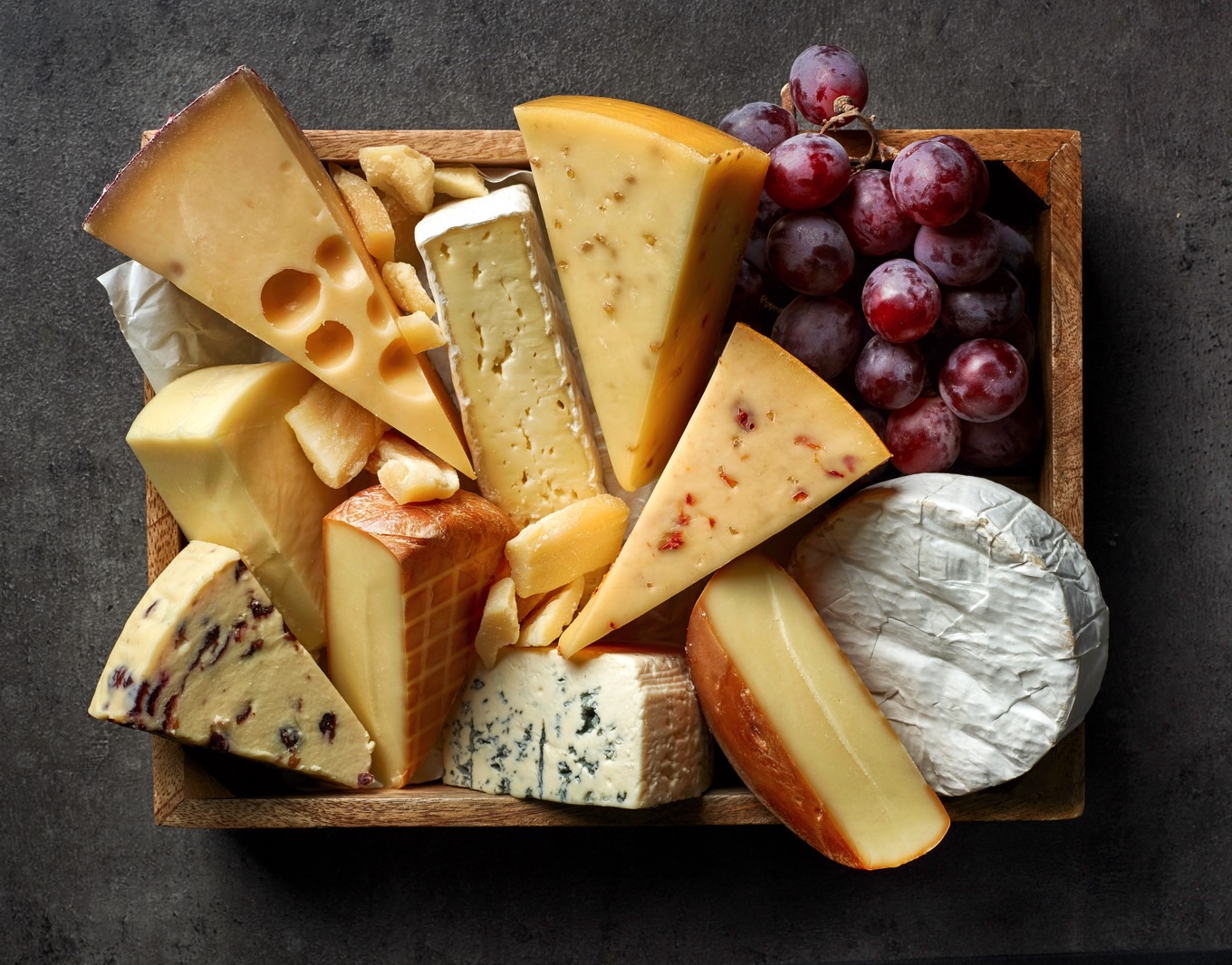 Various types of cheese on a platter