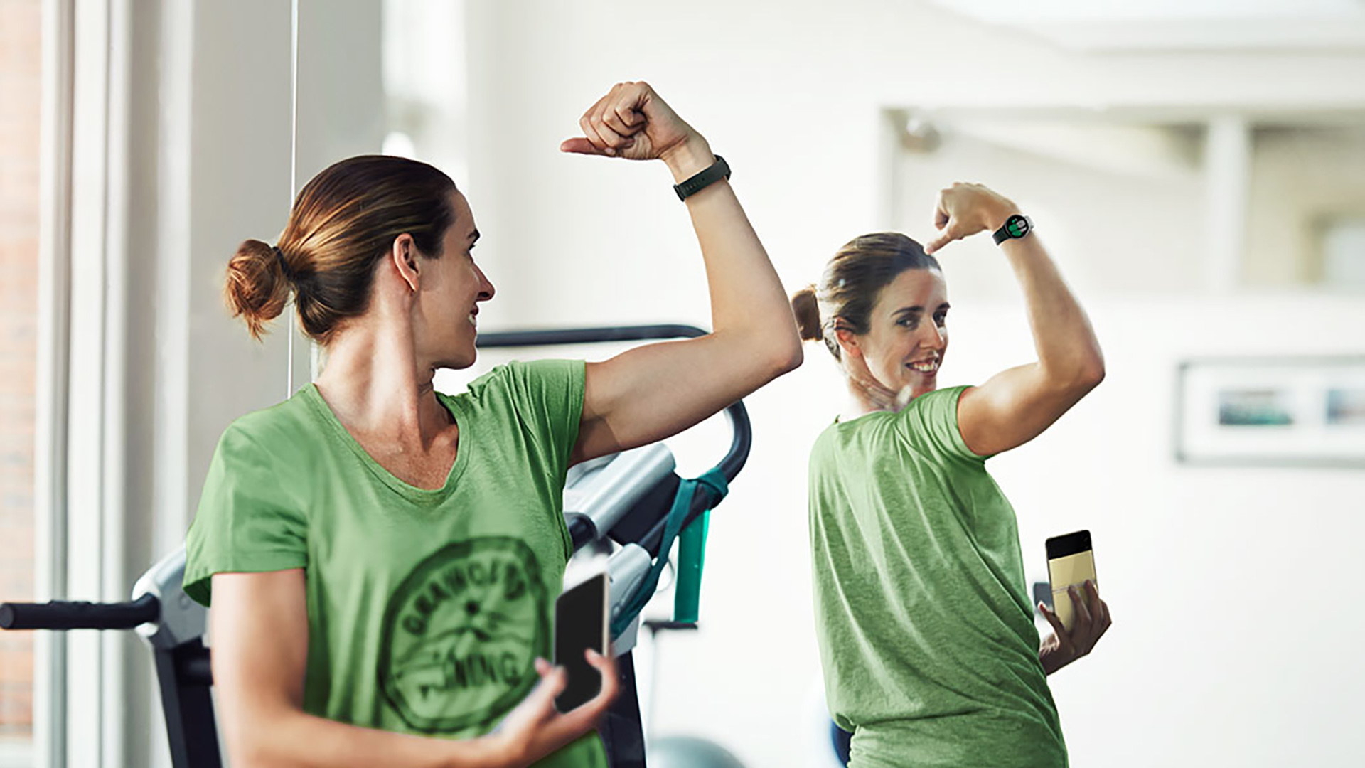 woman using Galaxy Watch during exercise