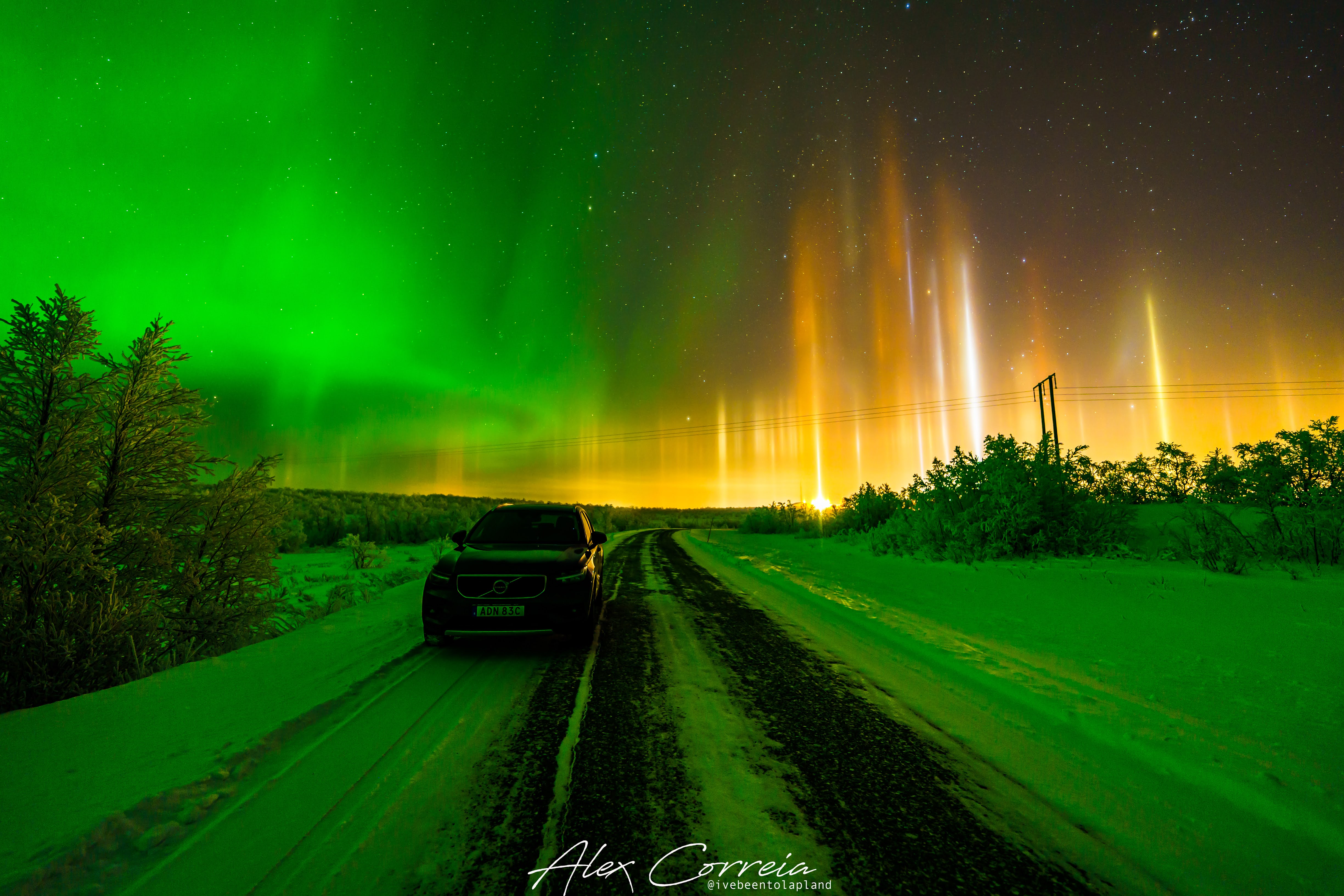 northern lights next to light pillars