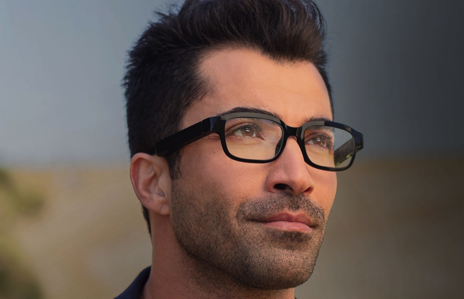 A person wearing Amazon Echo Frames glasses