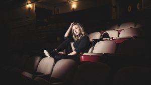 young woman in audience spotlight