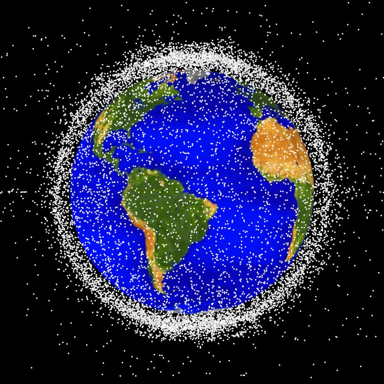 space junk and earth's satellites filling space around our planet