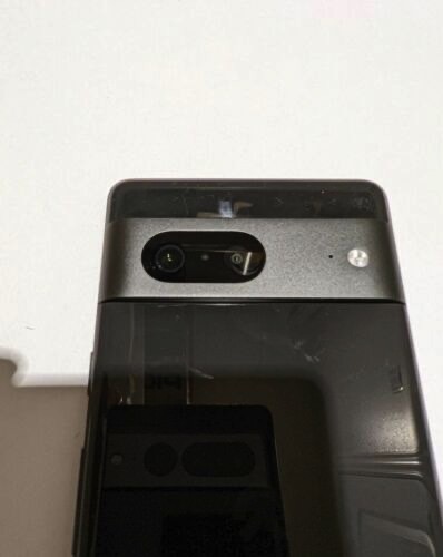 Rear of Pixel 7 prototype shows a reflection of the Pixel 7 Pro camera system.