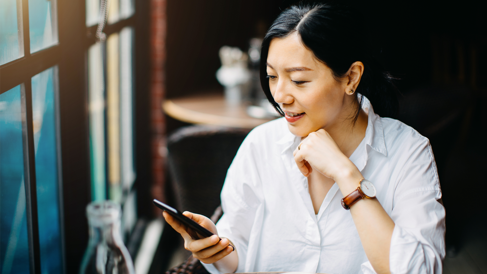 A lady looking at her phone