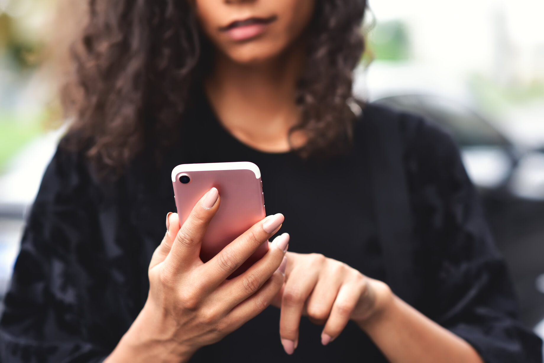 young woman texting on phone