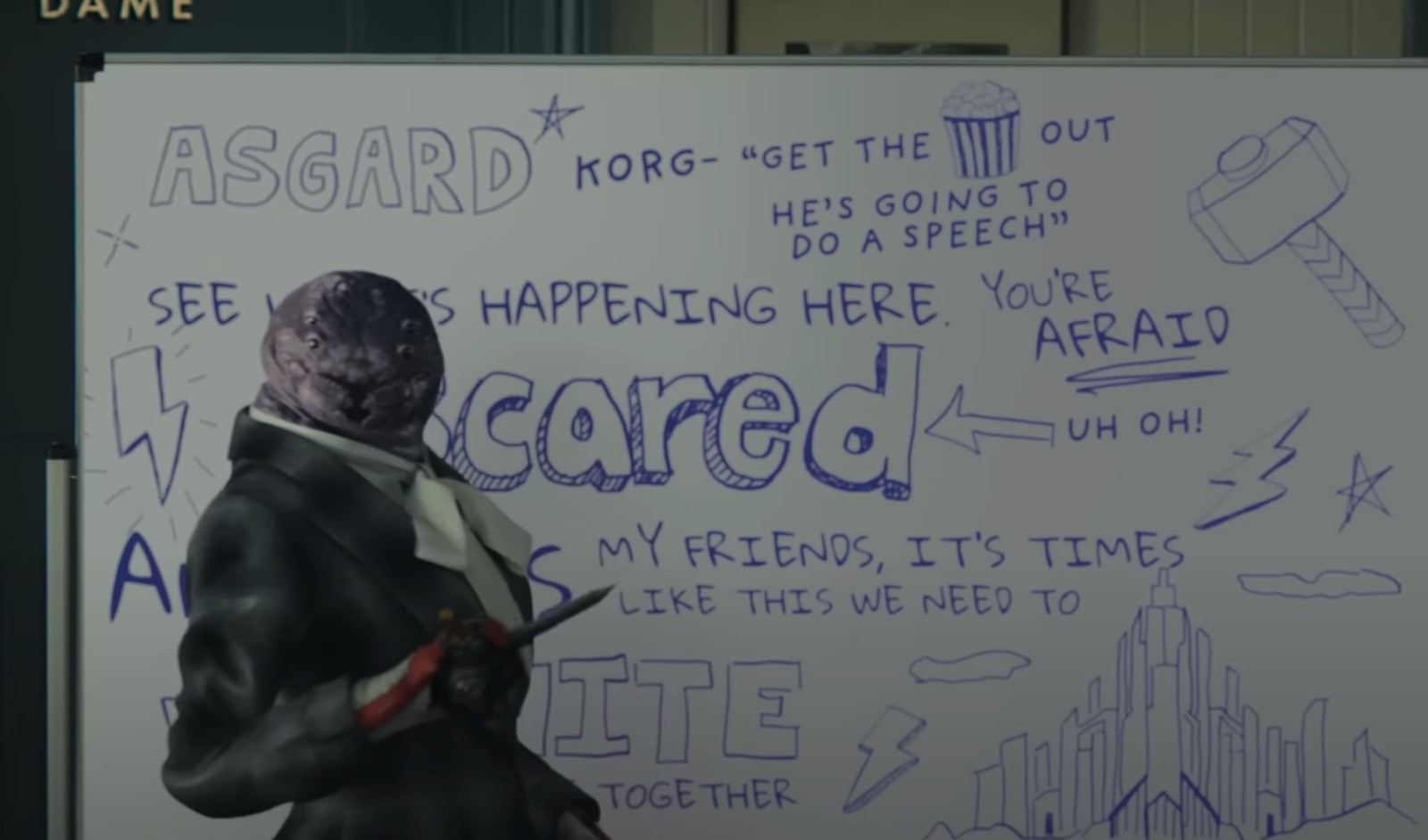 Miek in a suit, scribbling the speech Thor (Chris Hemsworth) gives in a new Thor: Love and Thunder promo clip.