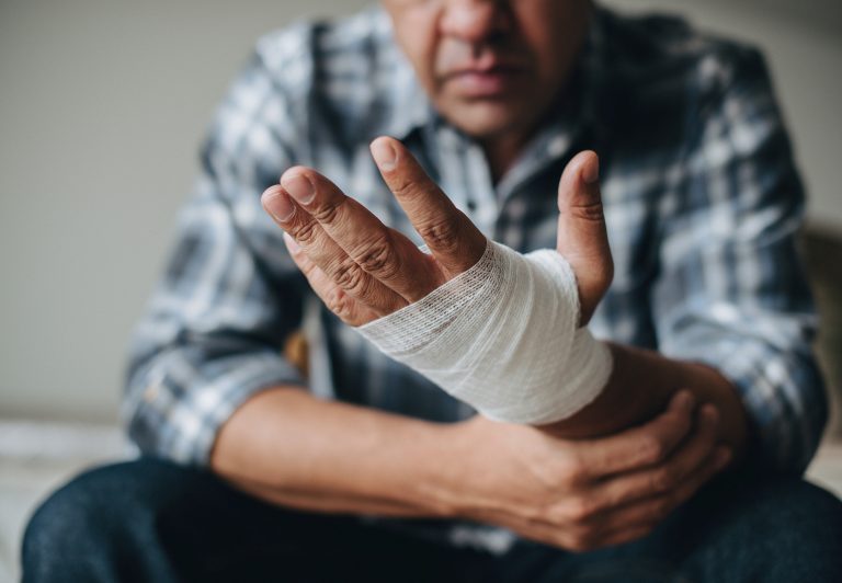 man with gauze healing wound faster