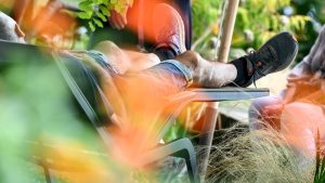 A man relaxes on a lounger at the Landesgartenschau on the shores of Lake Constance.