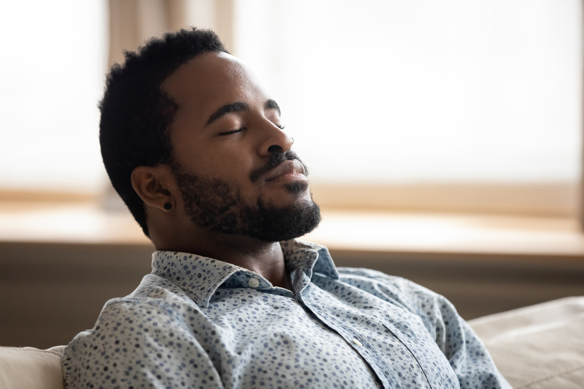 man doing breathing trick to stop stress