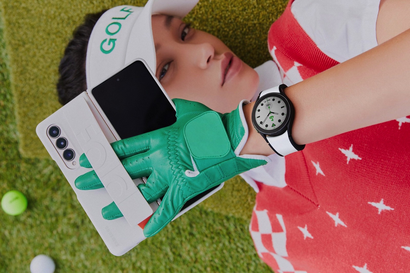 A person using the Galaxy Fold 4 and wearing the Galaxy Watch 5.