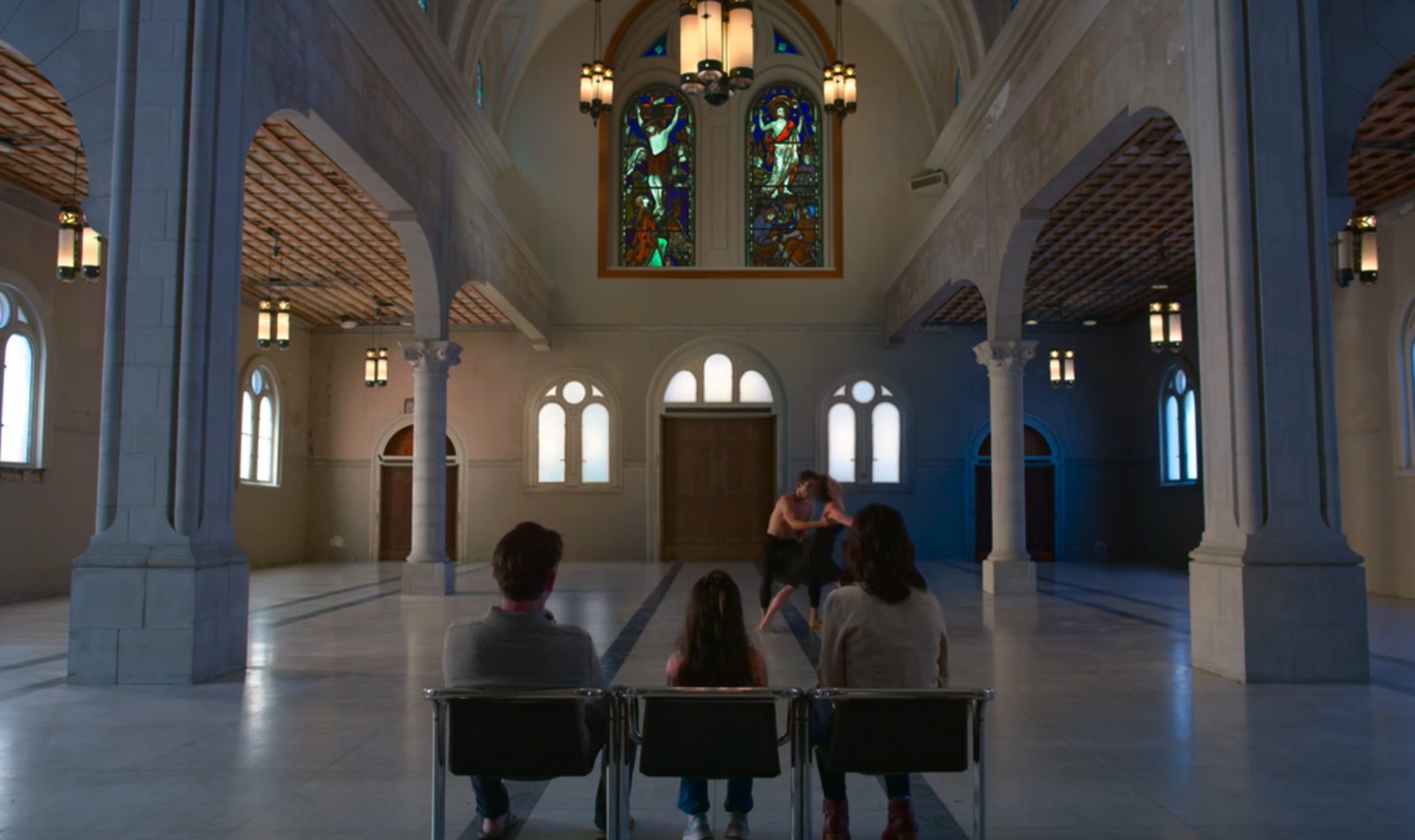 Three people enjoying an immersive, shared AR glasses experience: A live-like dance show.