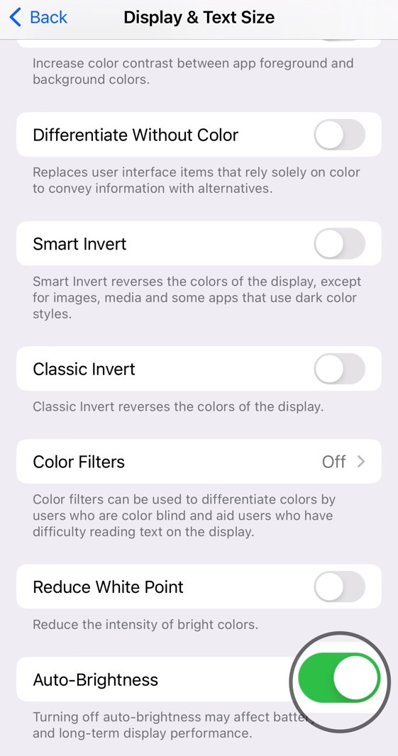 Enable screen auto-brightness on iPhone.